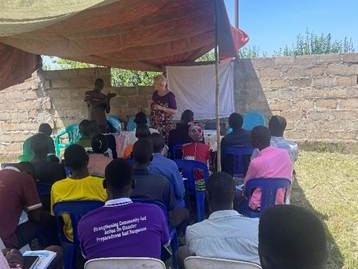 Teaching-under-a-make-shiift-tent-11-2025